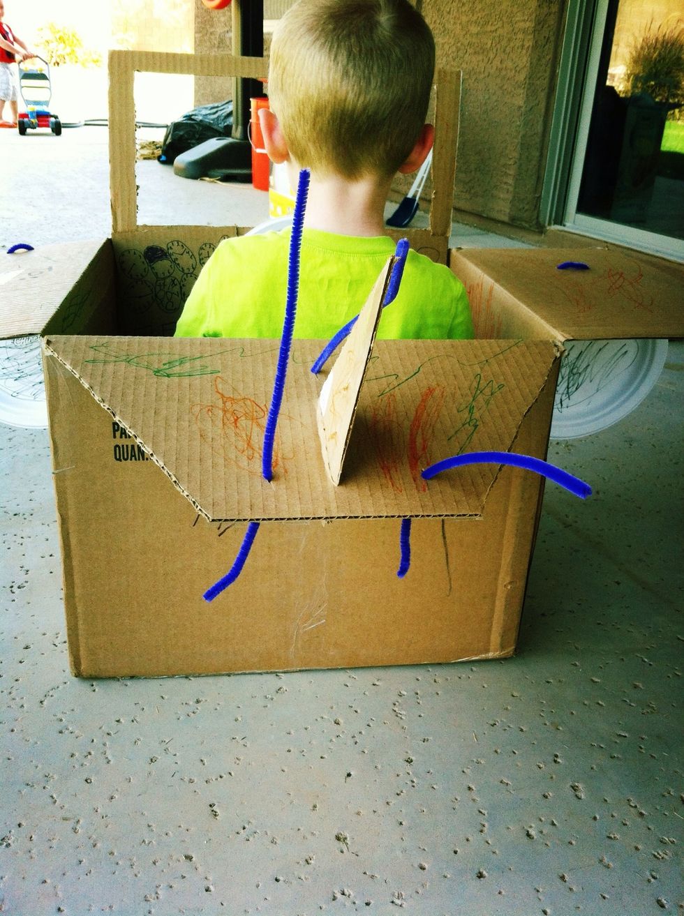 Use one of the triangle tail scrap pieces & insert into tail flap through a cut slit. Poke antenna pipe cleaners, if desired. Color & decorate airplane.