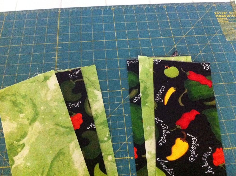 Use one set of 2 light/1 dark and one set of 2 dark/1 light strips. These sets of strips, sewn together will magically transform into your 9-patch blocks!