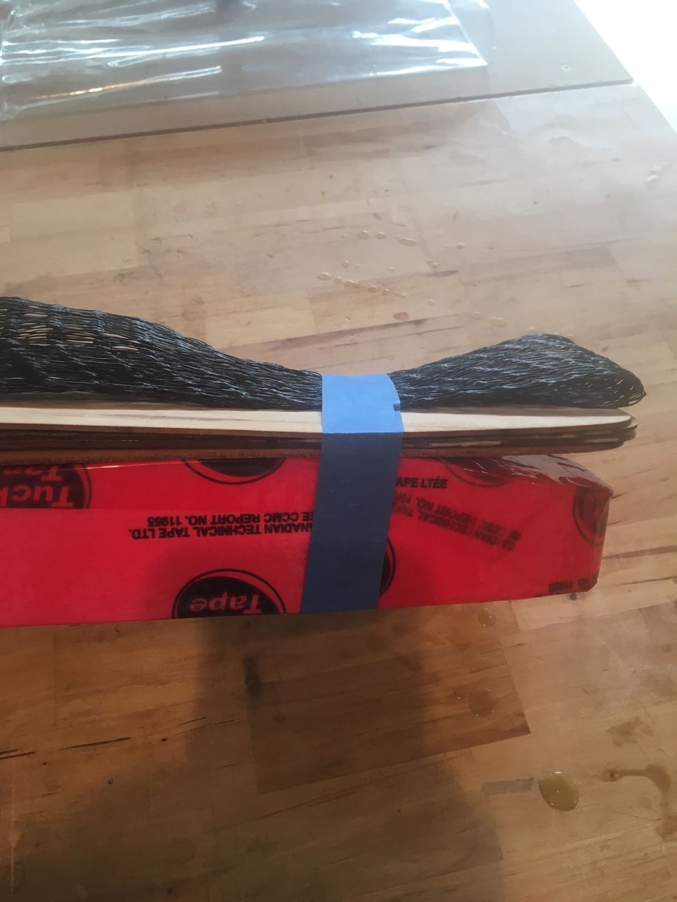 Use Painter's Tape to secure veneers to foam mold.