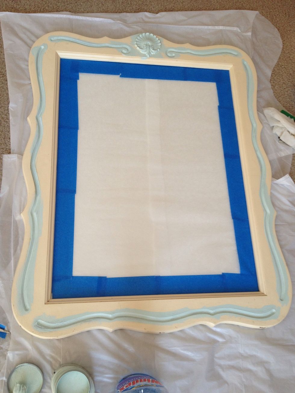 Use painters tape around the edges. I used tracing paper (or newspaper) in the middle.  The lines were filled with a dark gold. I started painting that so it could have the most coats.