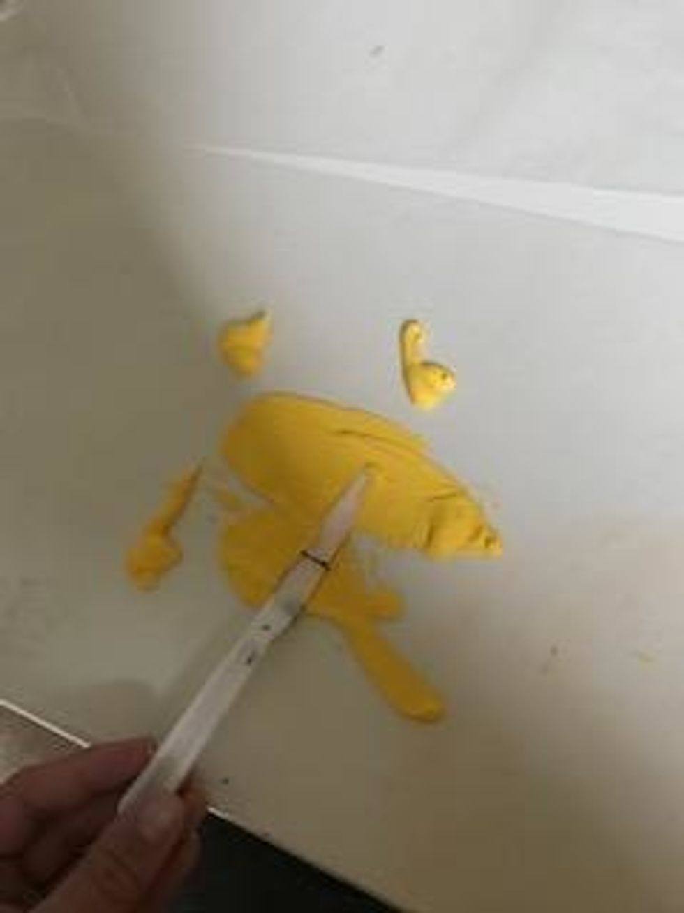 use palette knife to spread paint evenly