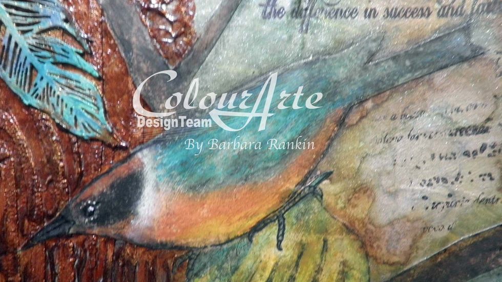 Use permanent black pen to detail the beak, eye, and feet of the bird image. Add a white dot from a gel pen to the eye to bring it to life.