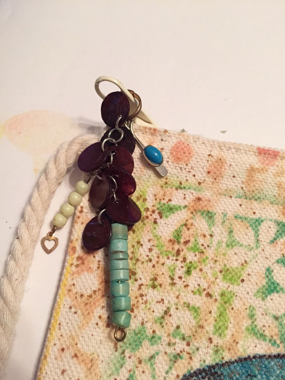 use pieces of "junque" jewelry to create a beaded accent to attach to zipper pull.