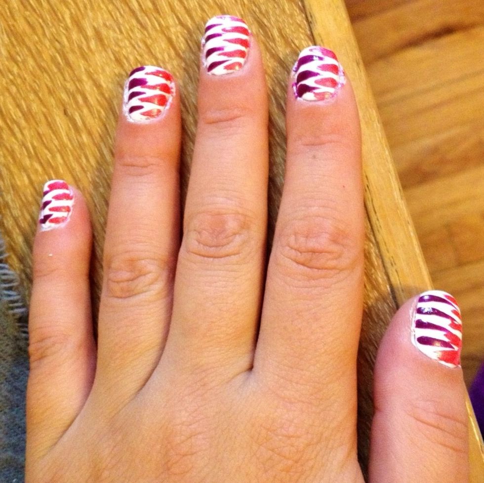 Use pink striper to create stripes on the other side of each nail