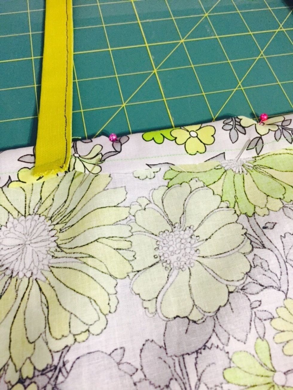 Use pins to secure the fabric for sewing.