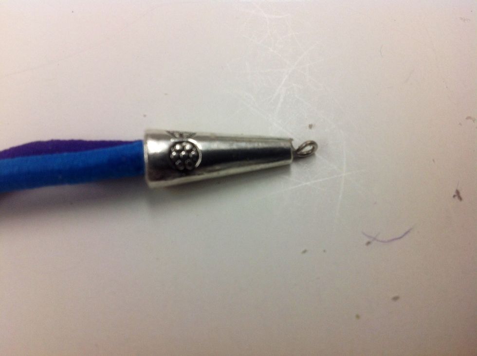 Use pliers to form a loop with the wire that protrudes from the bead cone.