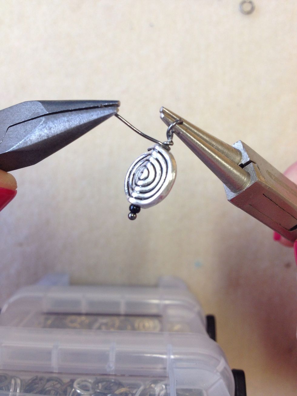 Use pliers to help wind the wire around the stem of the headpin