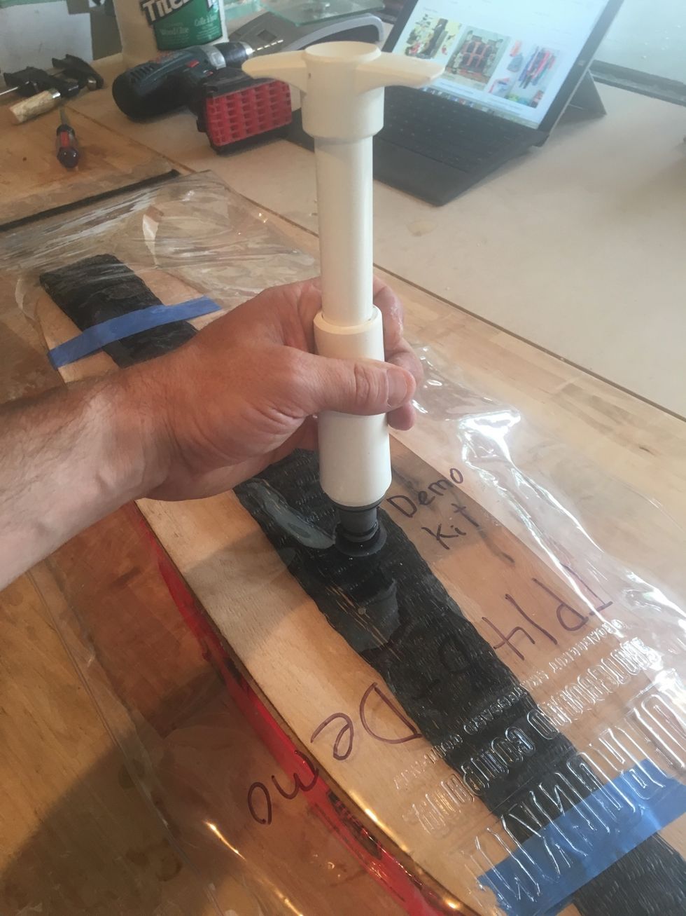 Use pump to remove air from the vacuum bag.