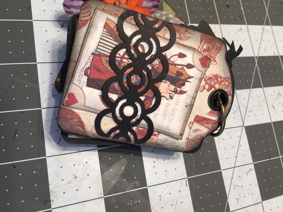 Use punched trim to create belly bands on some of the tag pages and insert a cut out from the collection.