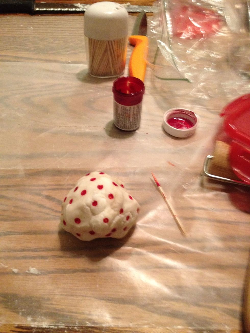 Use red fondant or color white fondant to use for the bow.