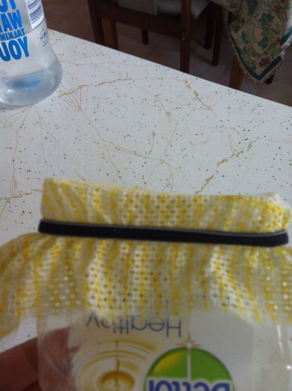 Use rubber band to secure to bottle