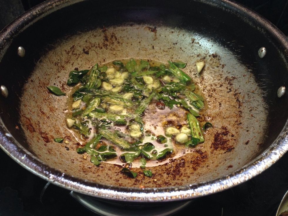 Use same oil (2 Tbl spoon) and fry the curry leaves, slit chillies and ginger garlic for a min.