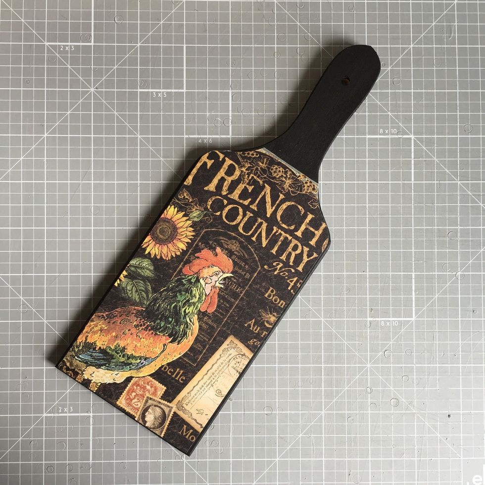 Use sand paper or a nail file to blend the edge of the paper and the board.