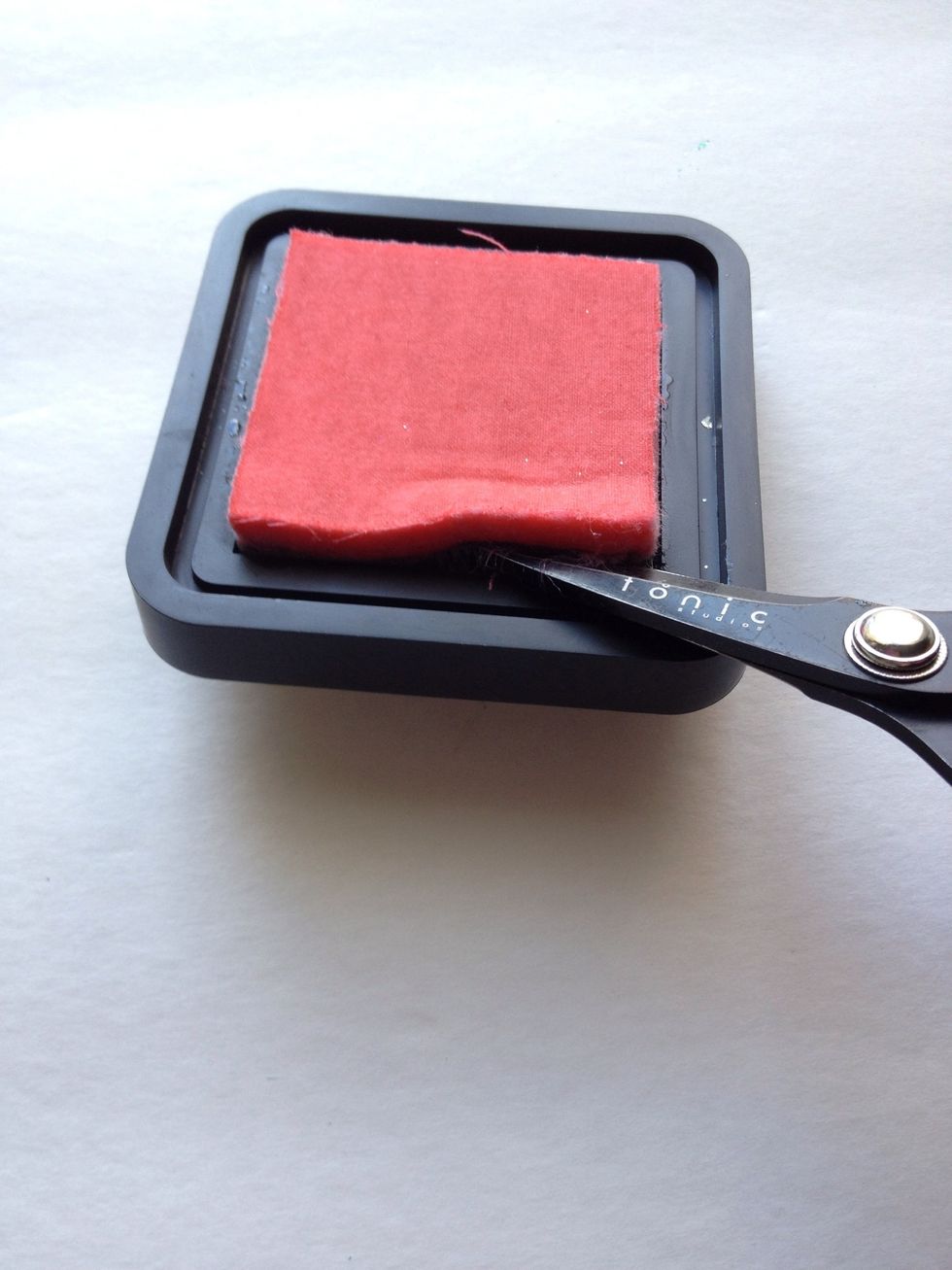 Use scissors or a craft knife to pry the ink pad from its base. It may take several minutes.