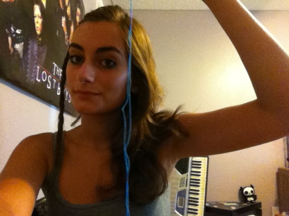 Use scissors to cut a length of thread that is about 1 and 2/3 the length of your dread WHEN FOLDED IN HALF. Mine is kind of small.