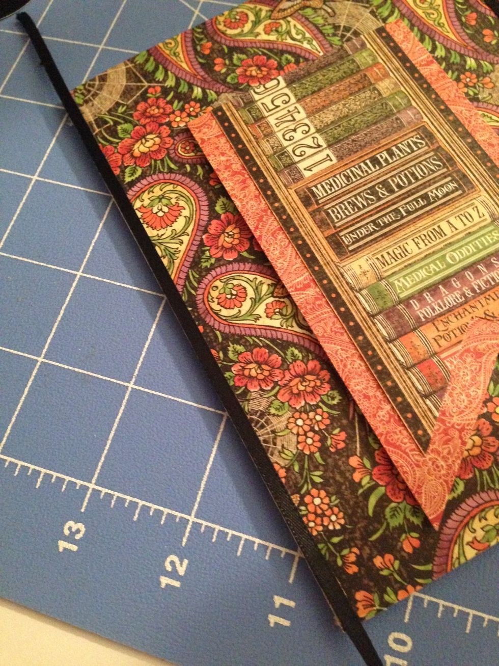 Use Scor-Tape to adhere the thin black ribbon to both sides of the card.