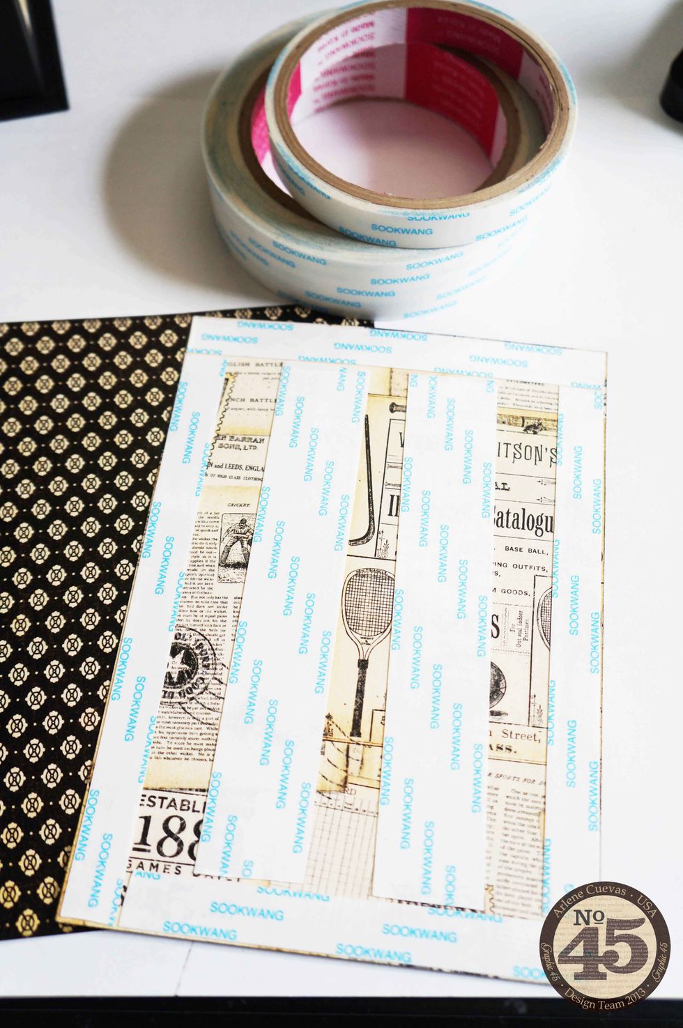 Use ScorTape or any strong adhesive to apply your design paper to the box. This will ensure the paper stays put over the years.