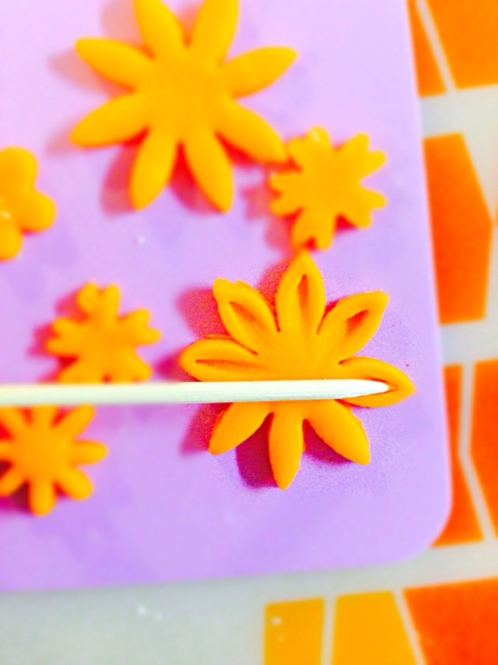 Use skewer to form the petals. Use your imagination.
