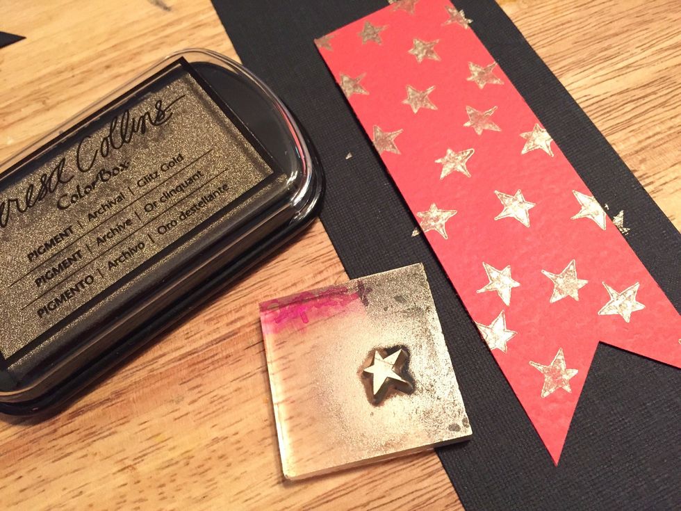 use small star and Glitz Gold Ink to add stars to red cardstock piece.