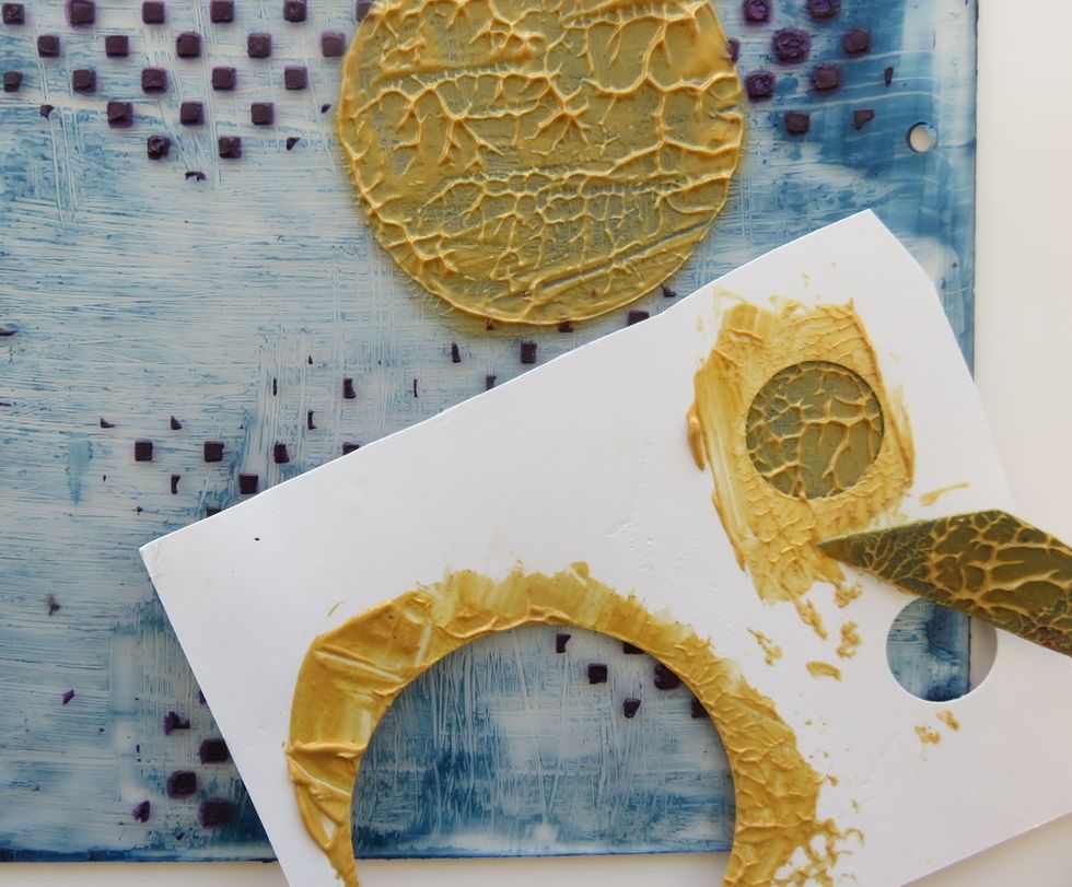 Use smaller circles to add Vegas Gold paint over the page randomly. Let the gold paint be totally dry before the next step.