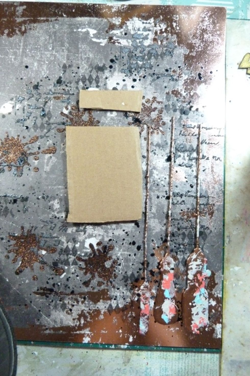 Use some cardboard to mount the photo and glue on to the layout to give it some dimension, along with the embossed chipboard light bulbs.