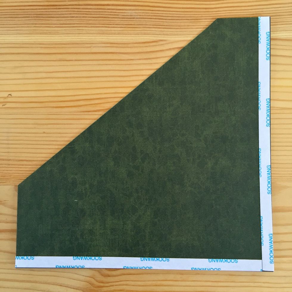 Use some double sided tape only on two sides.