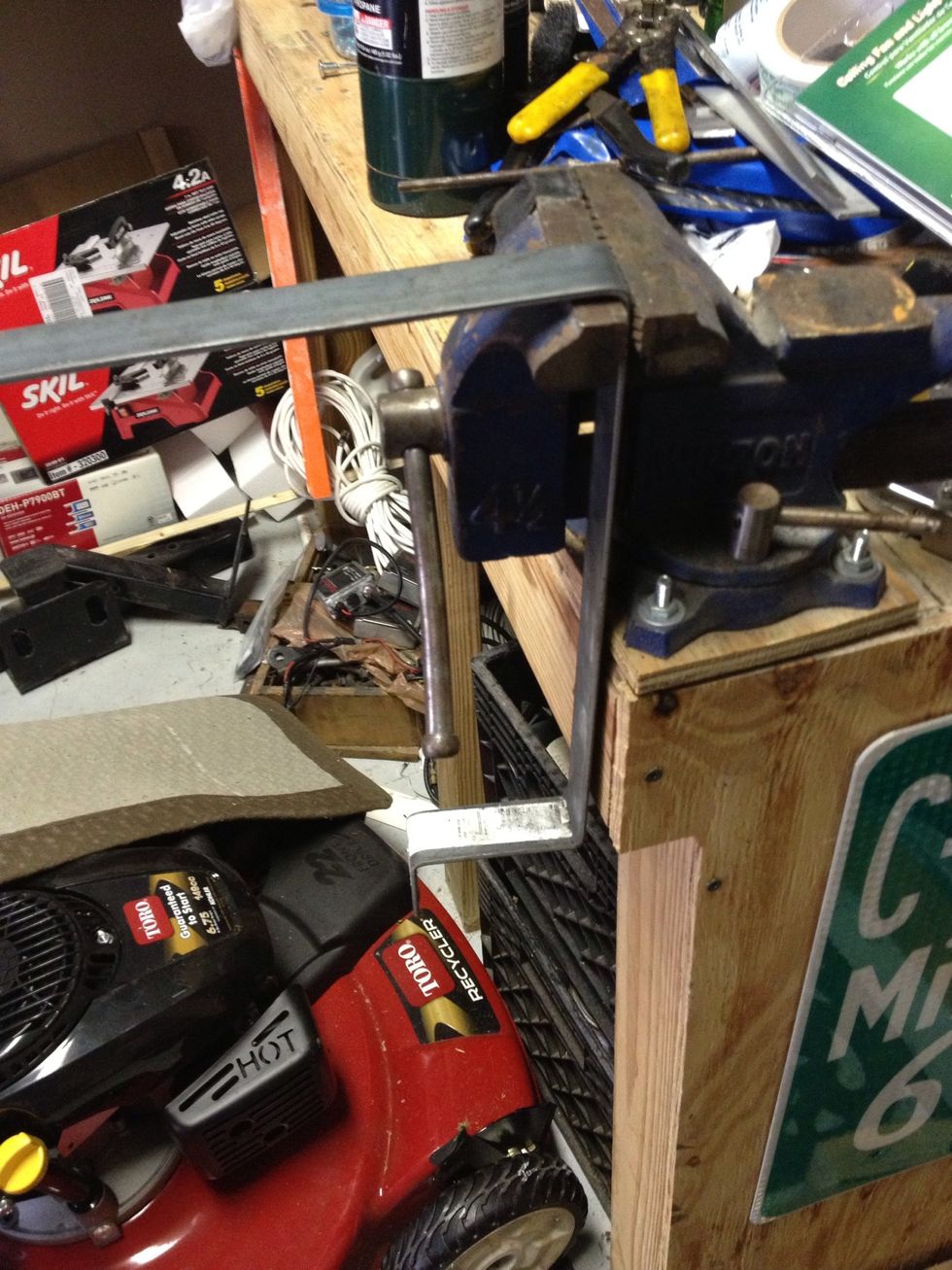 Use some flat steel and bent it with a rubber mallet and vice