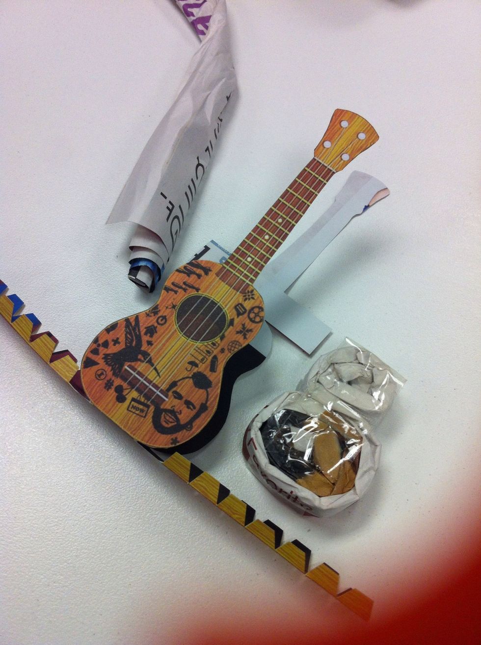 Use some piece of paper, pleat it in a small line and bend it in a shape of the model.