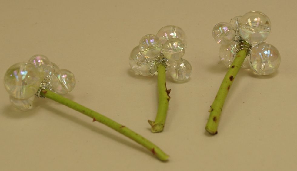 Use stems to insert bunches of Mega Beaded Wire into arrangement.