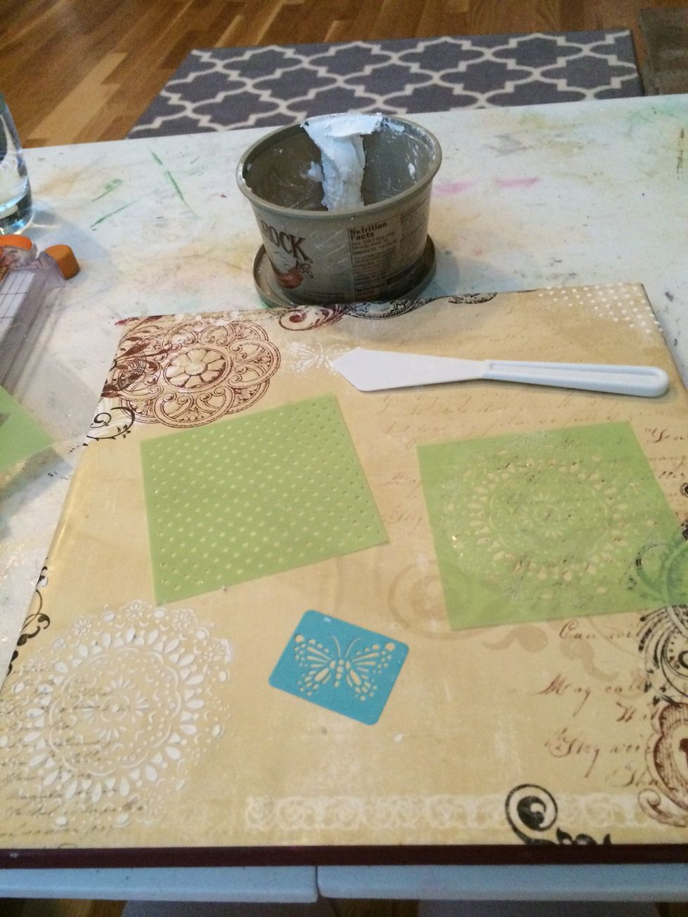 Use stencils and homemade texture paste to add texture designs.