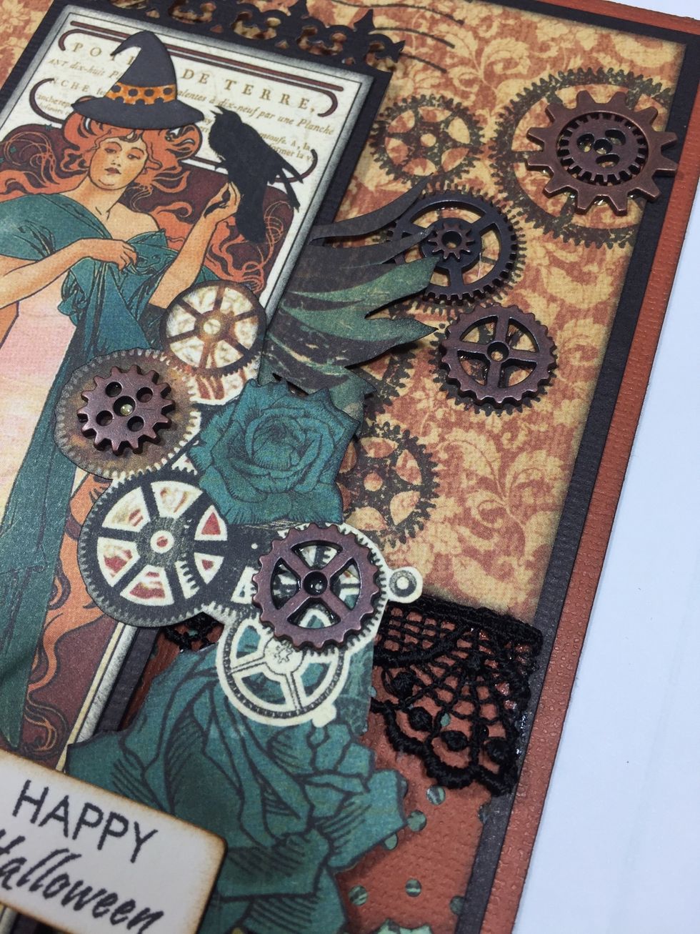 Use strong glue to adhere several small metal gears to the card front, as shown.