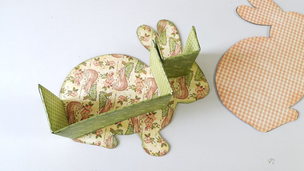 Use strong glue to hold the holders on one of the rabbit piece