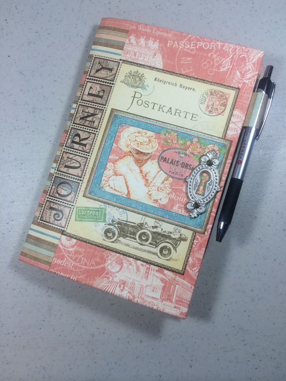 Use strong metal glue like E6000 to adhere a Shabby Chic metal keyhole to the cover.