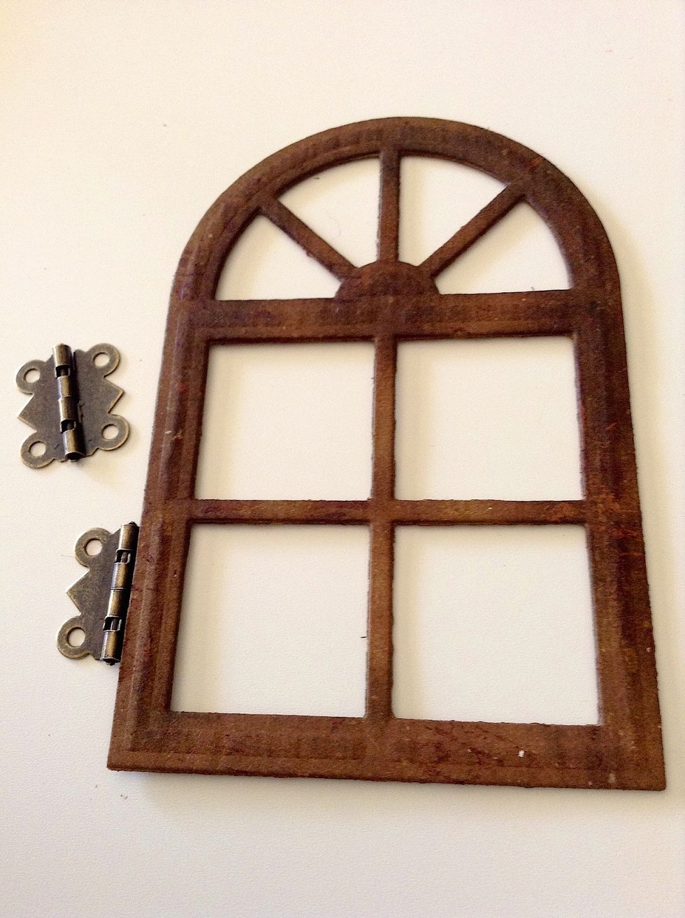 Use tacky glue to adhering two small hinges in the window.