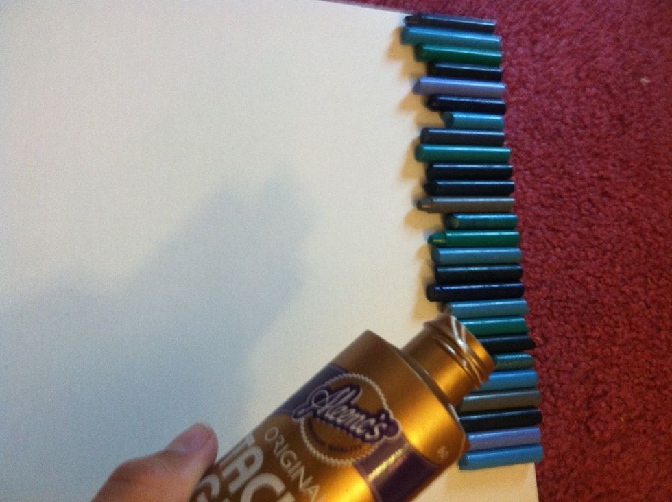 Use tacky glue to line your crayons on the top of the board.