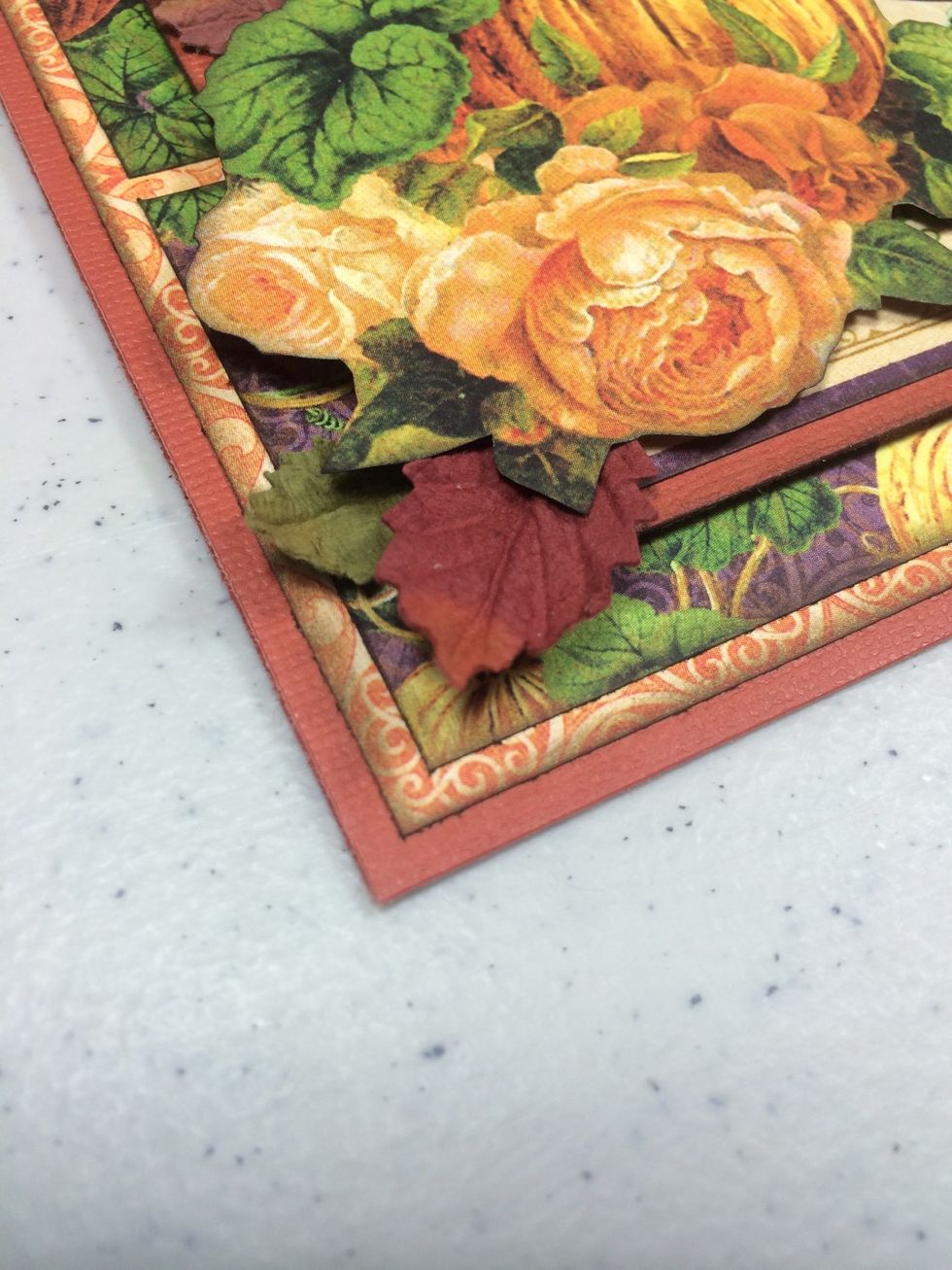 Use tacky glue to start adhering some Petaloo leaves here and there.