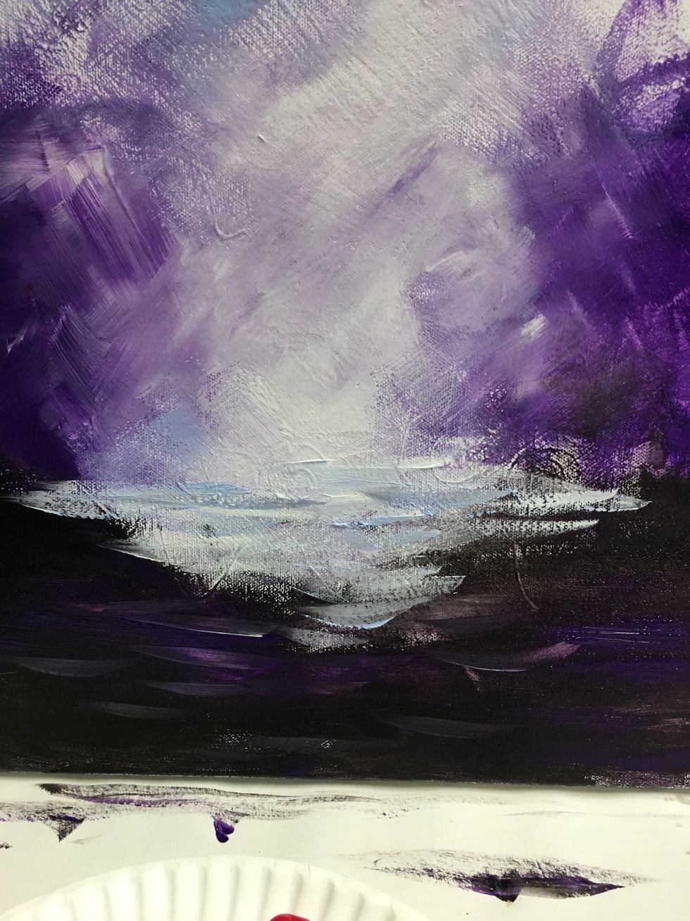 Use that technique all the way up, keeping the darker colors towards the outside. Add black paint to the bottom portion avoiding the center of the painting.