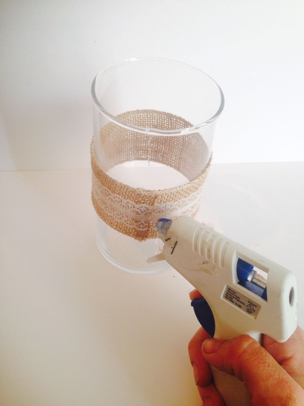 Use the 3 inch burlap to measure around the middle of the 8 inch votive. Secure the burlap with hot glue.