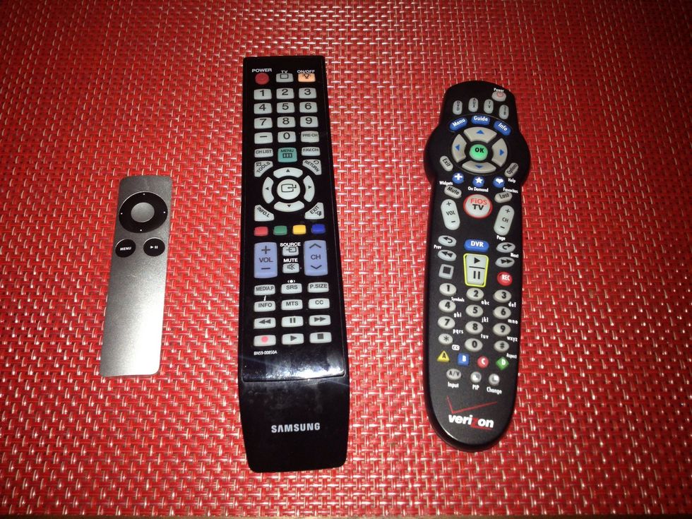 Use the appropriate remote control to turn on the video source and control it. The control on the left is for AppleTV. The control on the right is for the cable box