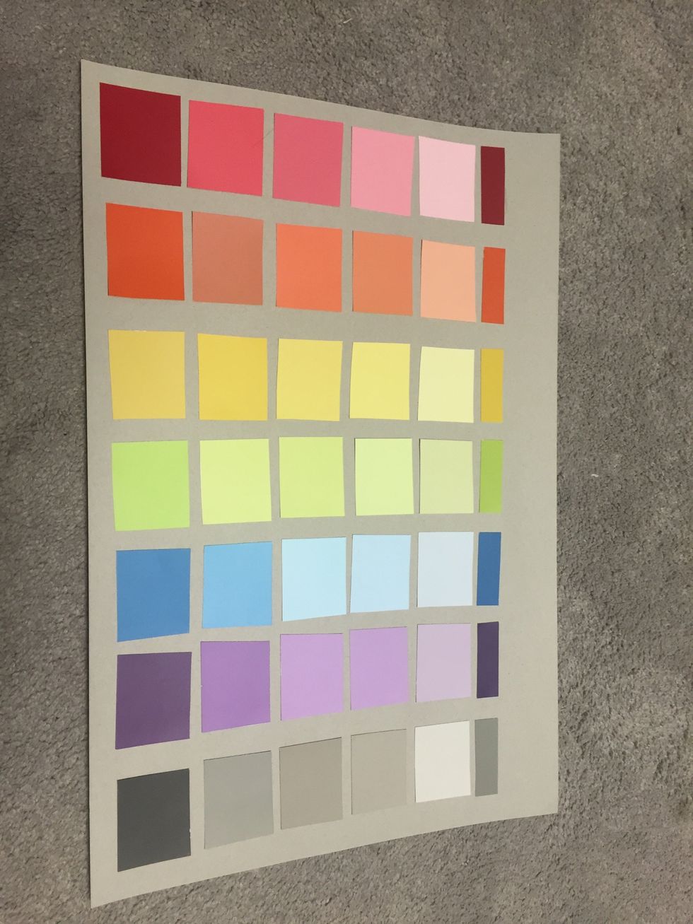 Use the back of the stock photo as a background, arrange the paint chips in 5 rows of 7 and tape them down. For the days of the week at the top, use scraps from the paint chips.