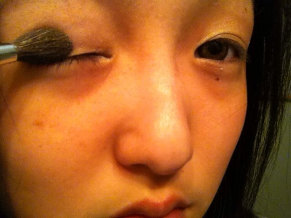 use the bigger brush and put the white eyeshadow on your whole eyelids. on the same places