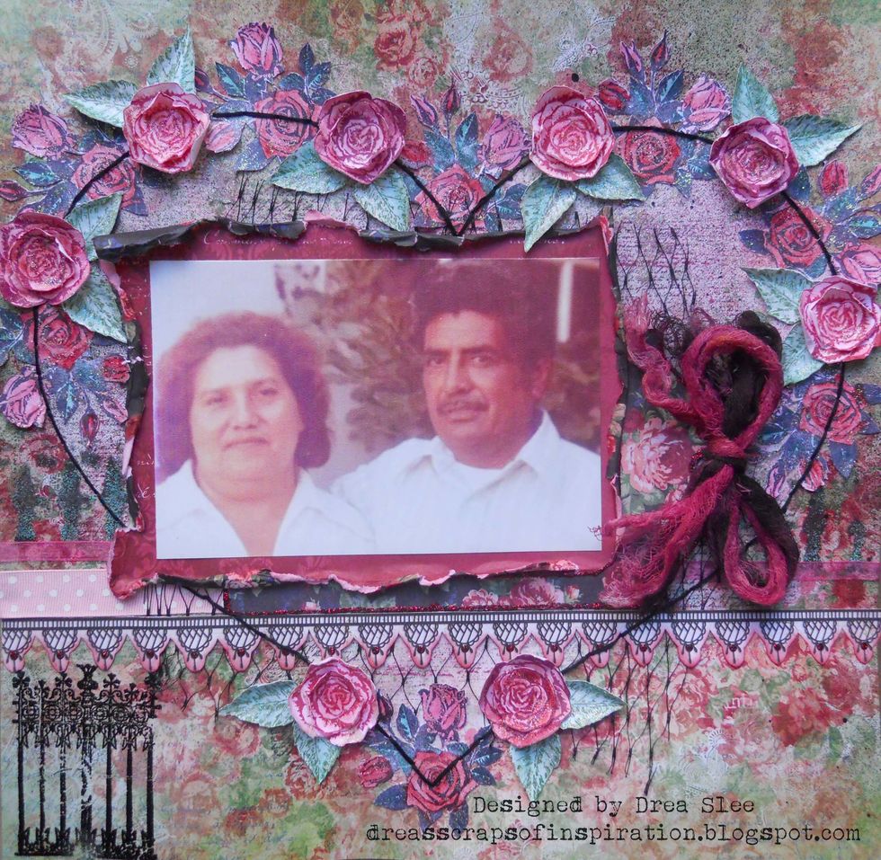 Use the Bo Bunny Floral Stamp to stamp the other roses and leaves using permanent red, burgundy, and green inks. Color again with Distress Inks and the Tim Holtz Water Brush Detailer.