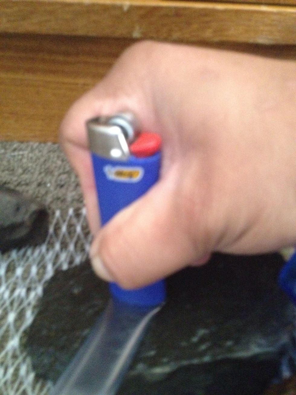 Use the bottom of the lighter to stamp seal the end of the hot tubing