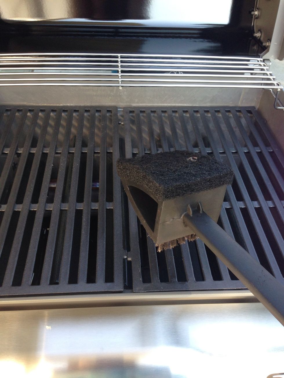 Use the bristle side of the grill cleaner first on the entire grill.