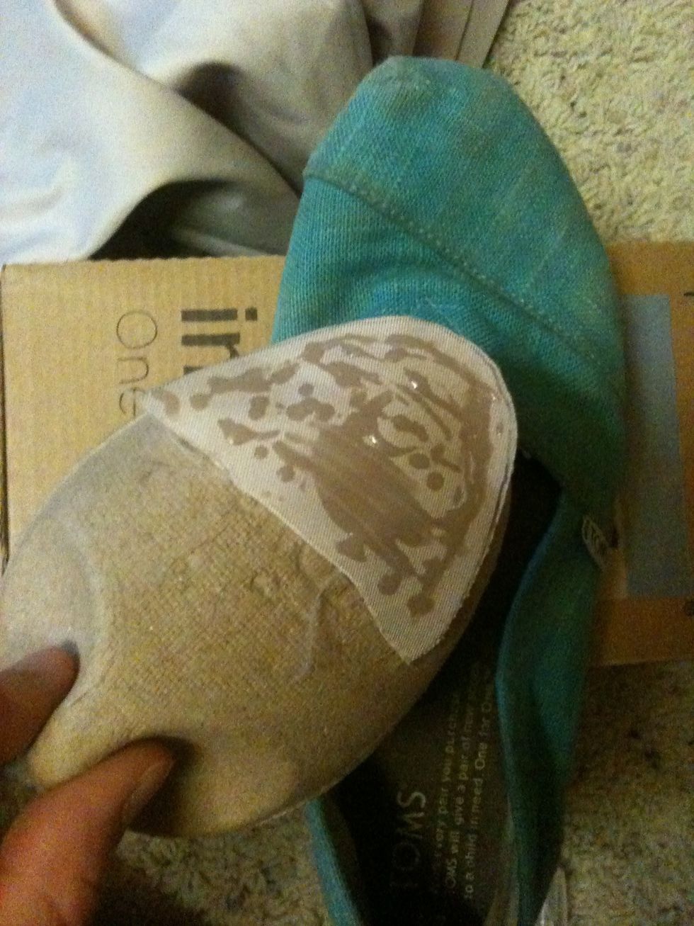 Use the cardboard insert that came with your TOMS to guide the fabric into place.