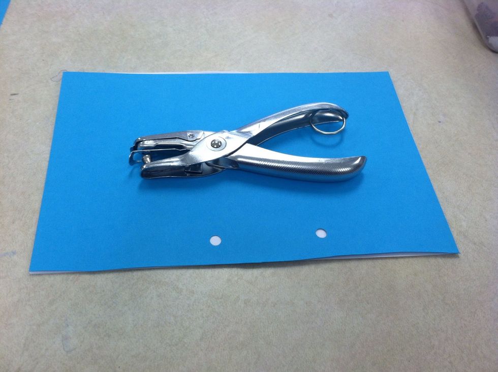 Use the cardstock on top of the remaining 5 sheets of copy paper. Make sure it is even punch holes over existing holes.