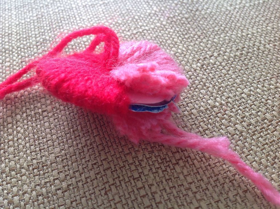 Use the circles (hoop) as a guide for you to cut, remember to cut in between the two circles.