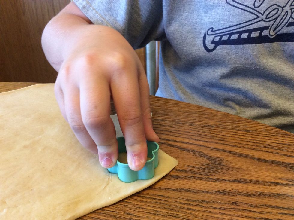 Use the cookies cutters and cut out the dough