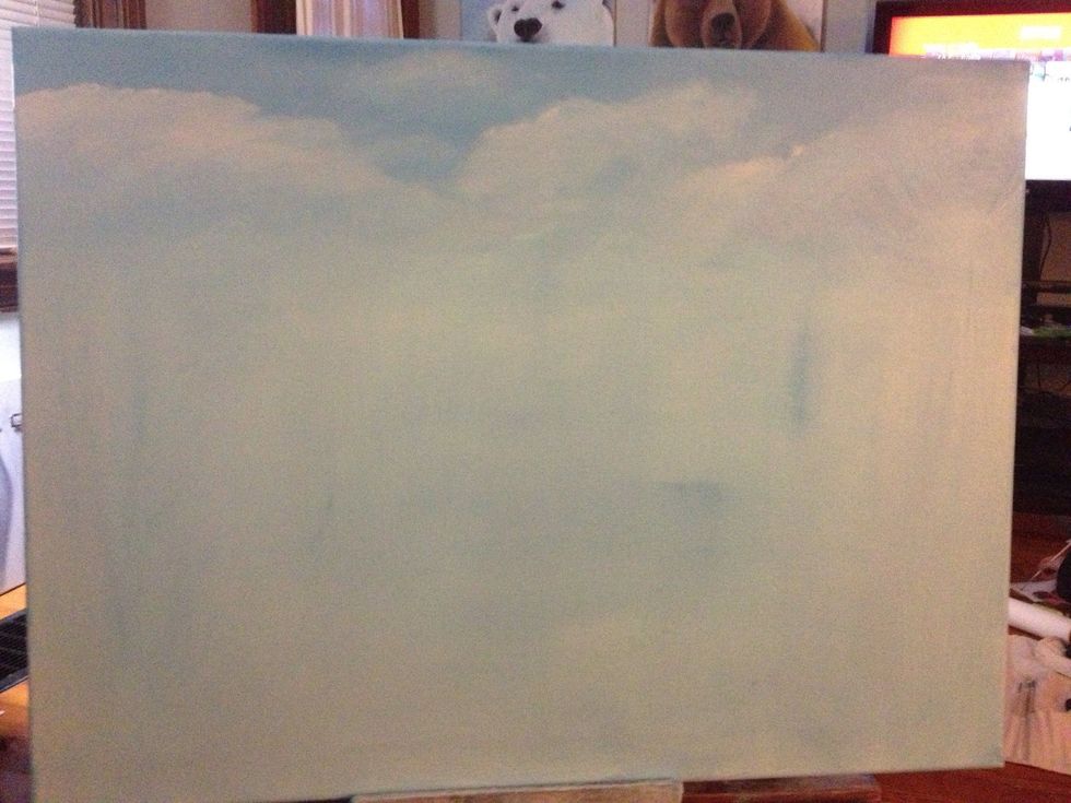 Use the corner of your clean chip brush and blend the clouds with small circles.