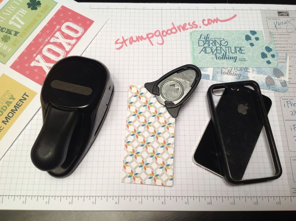 Use the corner rounder punch to round all corners on the paper.